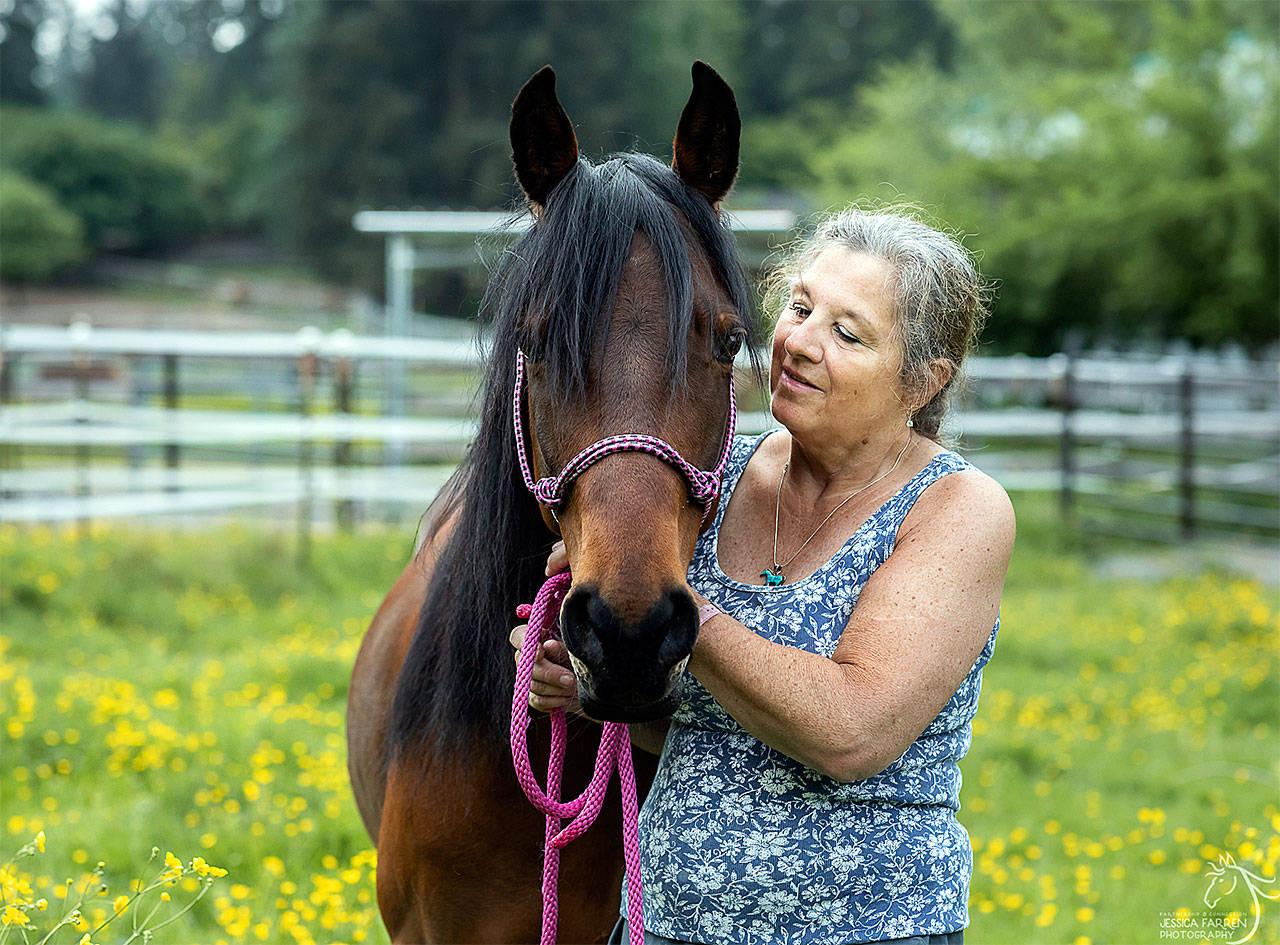 Volunteer Lillian Hinett with SAFE horse Stella, a Paso Fino cross and one of her favorite horses to care for at the Redmond nonprofit. (Photo by Jessica Farren)