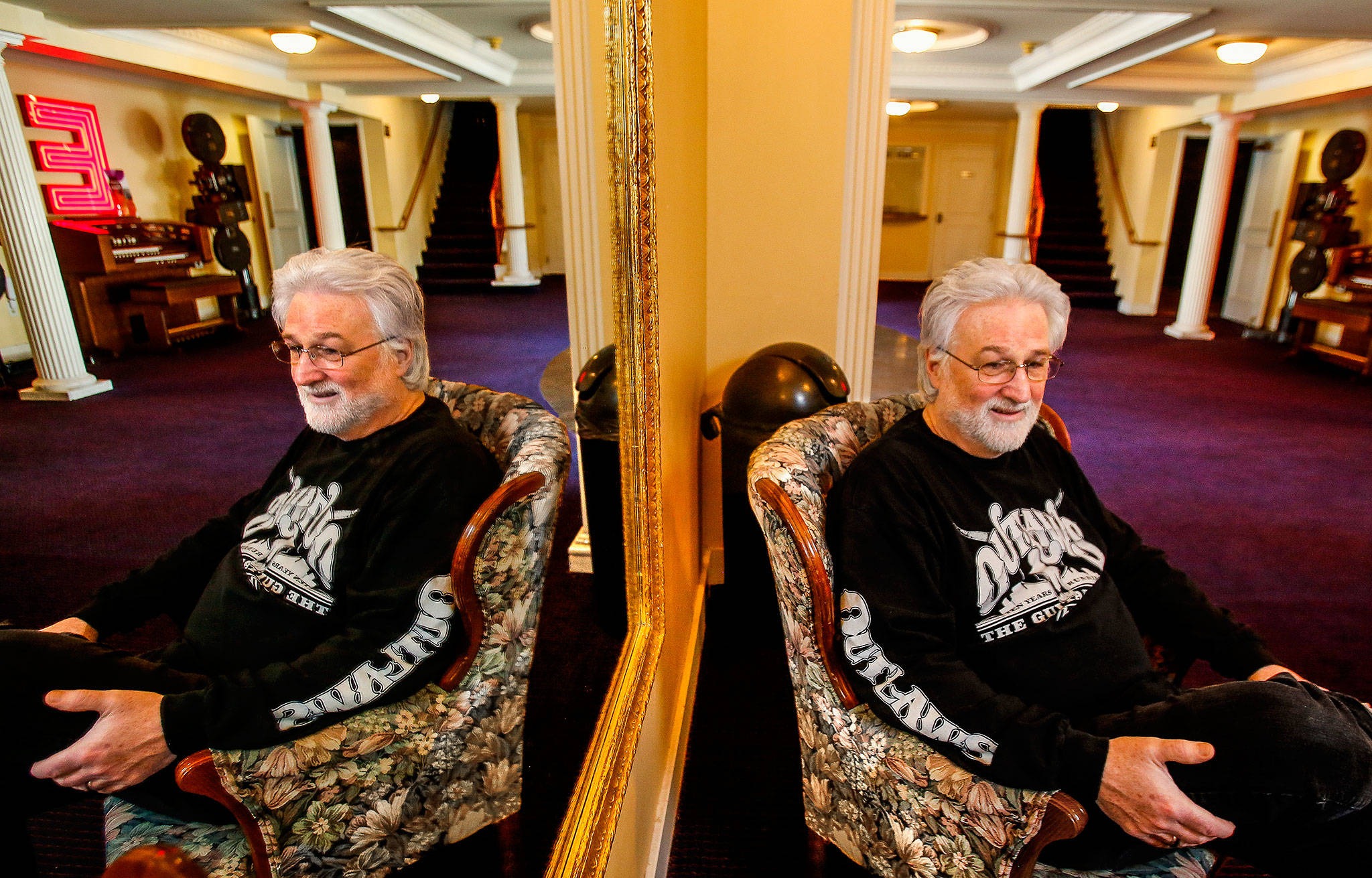 In Historic Everett Theatre manager Curt Shriner’s world, the question of saving or selling the old playhouse largely owned by his brother is a matter of finding more partners. The theater is for sale for $1.9 million. Curt Shriner, shown here in the mirrored lobby, plans to stay on as an owner and manager. (Dan Bates / The Herald)