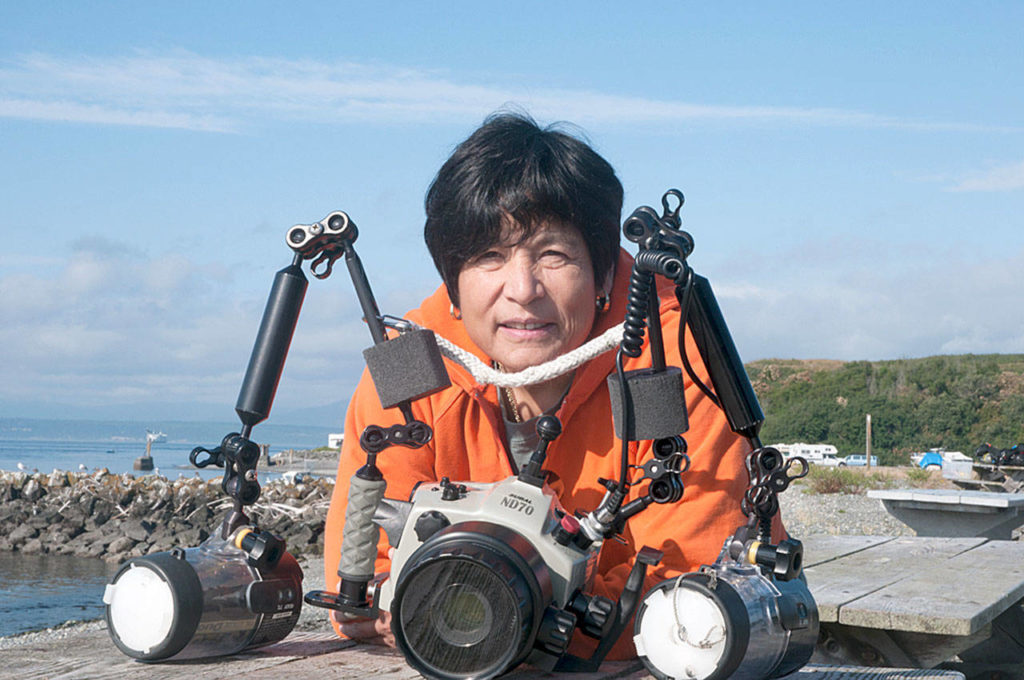 Underwater photographer Pat Gunderson with Keystone Jetty in the background. (Photo Dan Clements)
