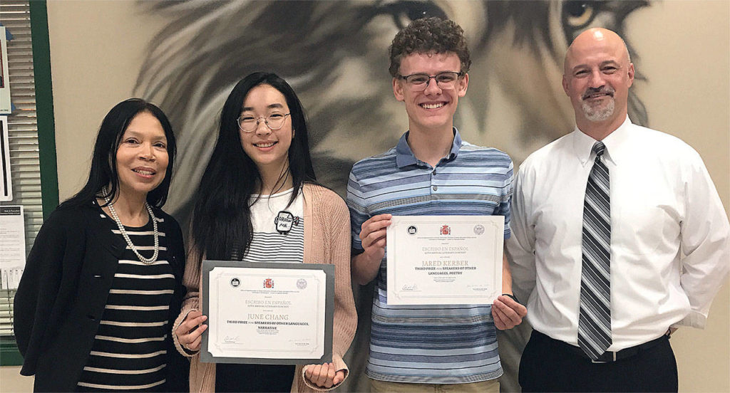 Jackson High School teacher Ivett Thompson (from left), students June Chang and Jared Kerber, and Principal Dave Peters celebrate the students’ top awards in the 20th annual “Yo escribo en Español” literacy contest. (Contributed photo)
