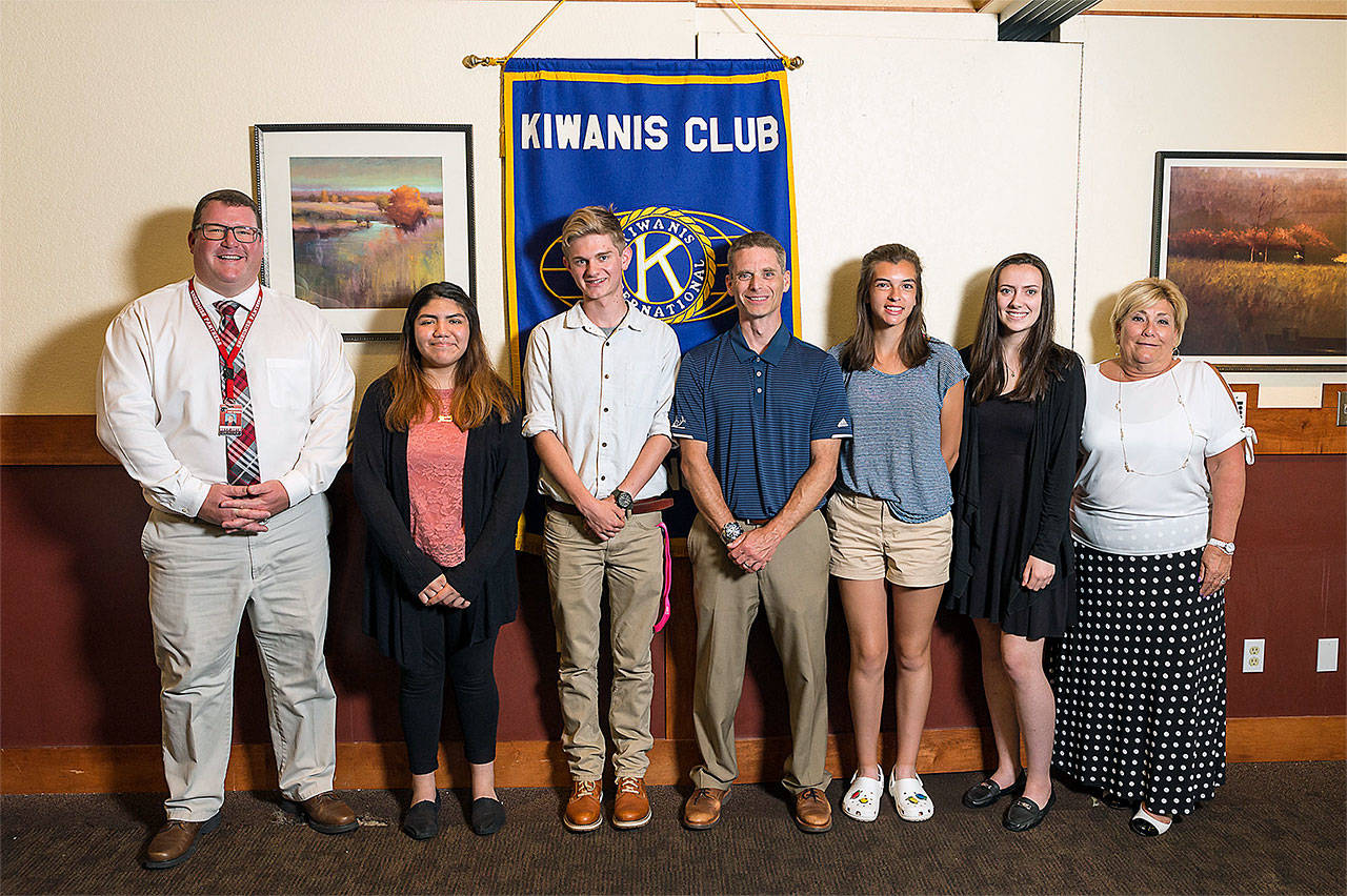 The Kiwanis Club of Snohomish recently awarded its 2018 scholarships. Pictured from left are Snohomish High School Principal Eric Cahan, Jennifer Mendez, Ryan Harris, Glacier Peak High School Principal Jeff Larson, Angela Bleeker, Savanna Bruno, and AIM High School Director June Shirey. Not pictured are Elena Forster, Michaela Rogalinski, Jaycee Isenhart and Jaina Smay. (Contributed photo by Jared M. Burns)