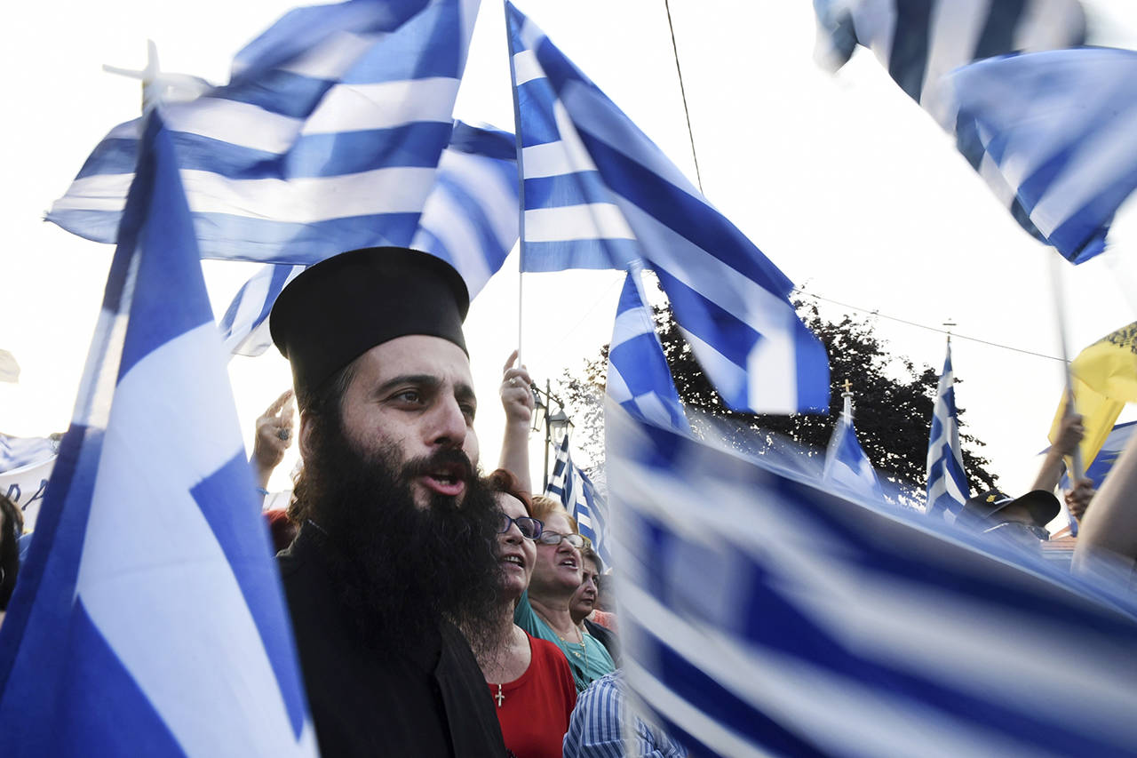 A Greek Orthodox priest shouts slogans during a rally in Pella, northern Greece, on Wednesday. Thousands of protesters gathered near the birthplace of Alexander the Great in northern Greece to demand that the Greek government take a tough stance with Macedonia over the latter country’s name. (AP Photo/Giannis Papanikos)