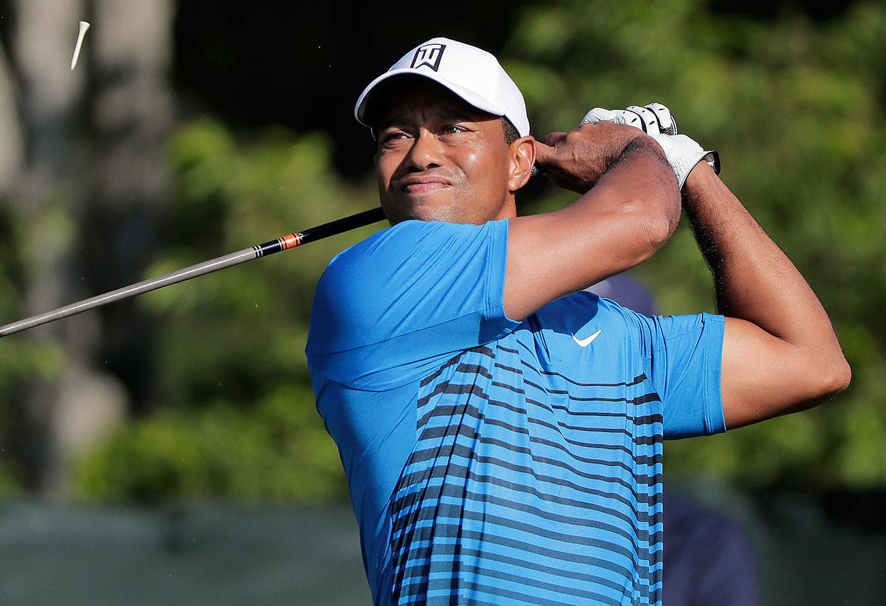 Tiger Woods tees off on the fourth hole during a practice round for the U.S. Open on Tuesday at Shinnecock Hills in Southampton, New York. (AP Photo/Julie Jacobson)