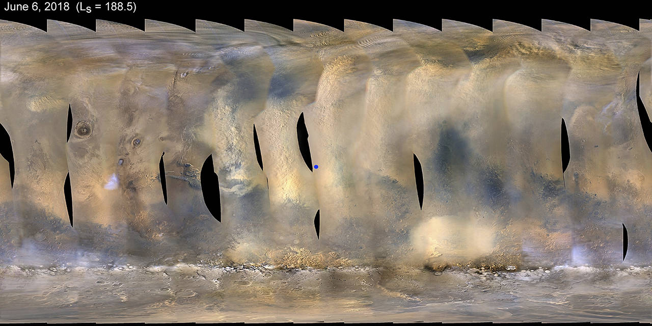 This composite image made from observations by NASA’s Mars Reconnaissance Orbiter spacecraft shows a global map of Mars with a growing dust storm as of June 6. The storm was first detected on June 1. The blue dot at center indicates the approximate location of the Opportunity rover. (NASA/JPL-Caltech/MSSS via AP)