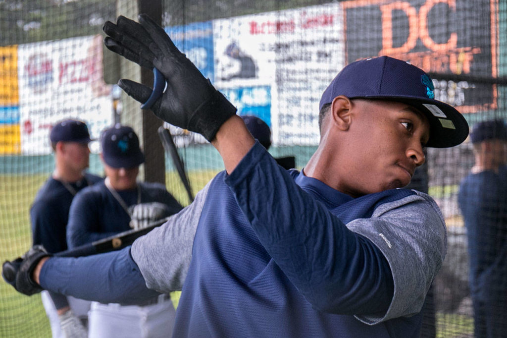 Ronald Rosario after a swing in the batting cage during practice at Everett Memorial Stadium in Everett Wednesday afternoon on June 12, 2018. (Kevin Clark / The Herald)
