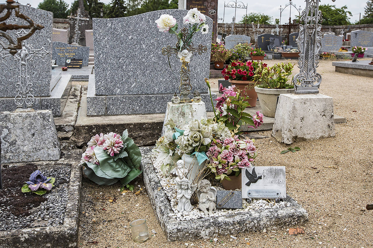 The grave of an unidentified girl found dead in a ditch along the A10 freeway close to the city of Blois in August 1987 is pictured in Suevres, France, on Thursday. (AP Photo)