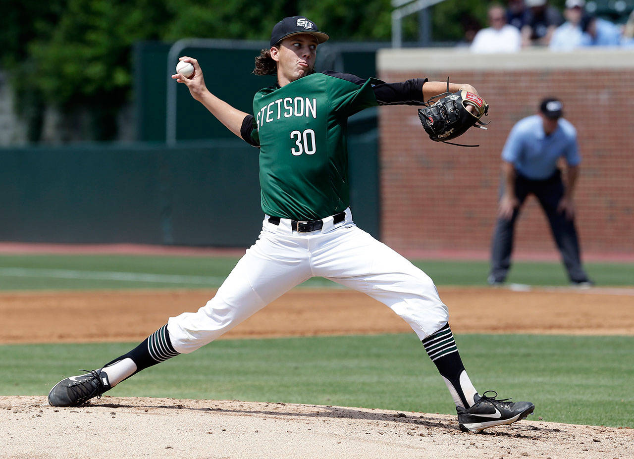 Stetson University pitcher Logan Gilbert (30) throws against North Carolina during the first inning of their NCAA super regional game on June 8. The Seattle Mariners selected Gilbert in the first round of the recent major-league draft. (AP Photo/Gerry Broome)