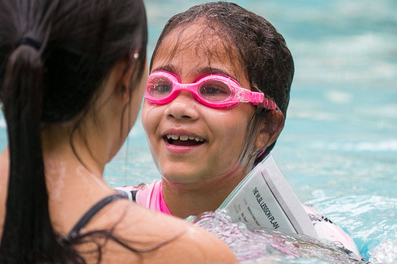 Tamia Reese reacts during swim safety lessons Thursday afternoon at the Lynnwood Recreation Center. (Kevin Clark / The Herald)