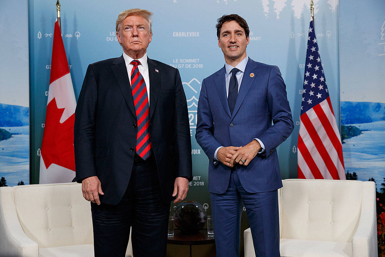 President Donald Trump meets with Canadian Prime Minister Justin Trudeau at the G-7 summit in Charlevoix, Canada, on June 8. (AP Photo/Evan Vucci)