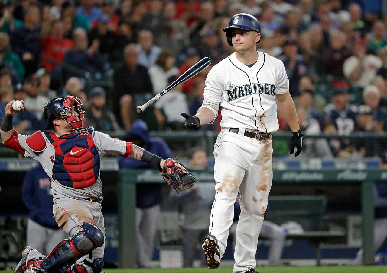 Seattle’s Kyle Seager flips his bat after striking out in the seventh inning of Thursday’s game at Safeco Field. (AP Photo/Elaine Thompson)