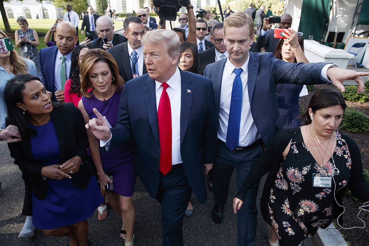President Donald Trump speaks to reporters at the White House on Friday in Washington. (AP Photo/Evan Vucci)