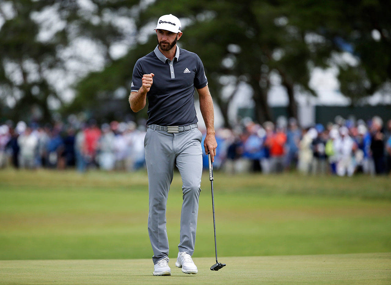 Dustin Johnson reacts after making a putt for birdie on the fourth green during the second round of the U.S. Open on June 15, 2018, in Southampton, N.Y. (AP Photo/Seth Wenig)