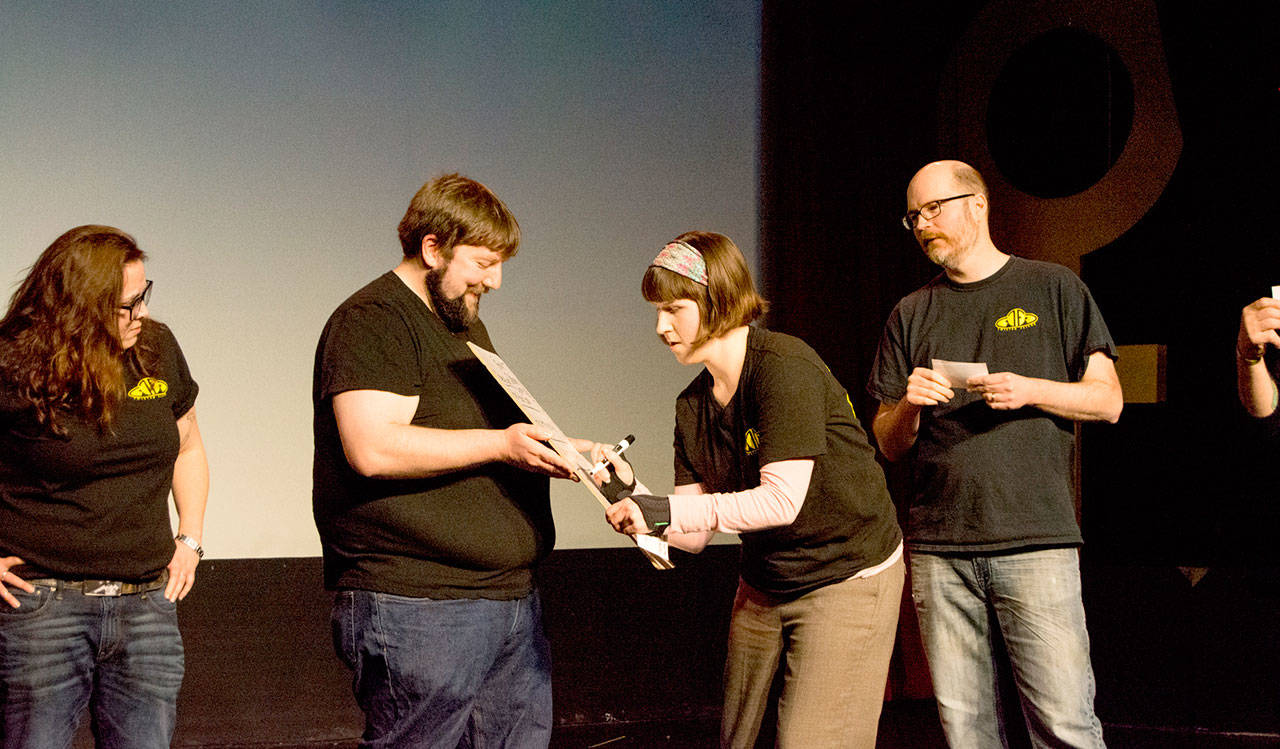 Mandy Price, Glenn Bristol, Amanda Marie Sproule and Jerry Haener, all Jet City Improv members, get ready for a Twisted Flicks performance. (Duncan MacDonald / Jet City Improv)