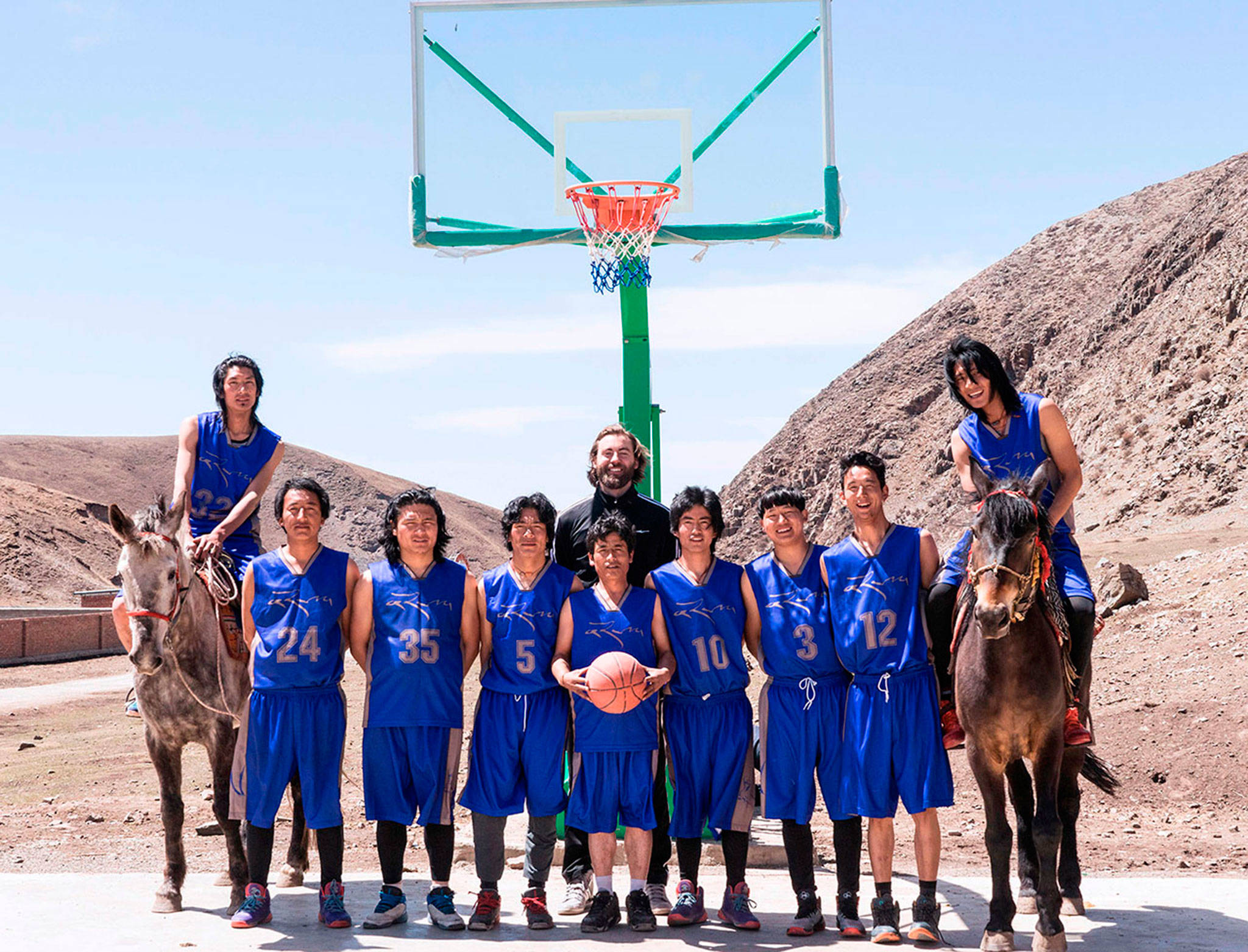 Bill Johnson poses with his team. (Chang Ai Media Project)
