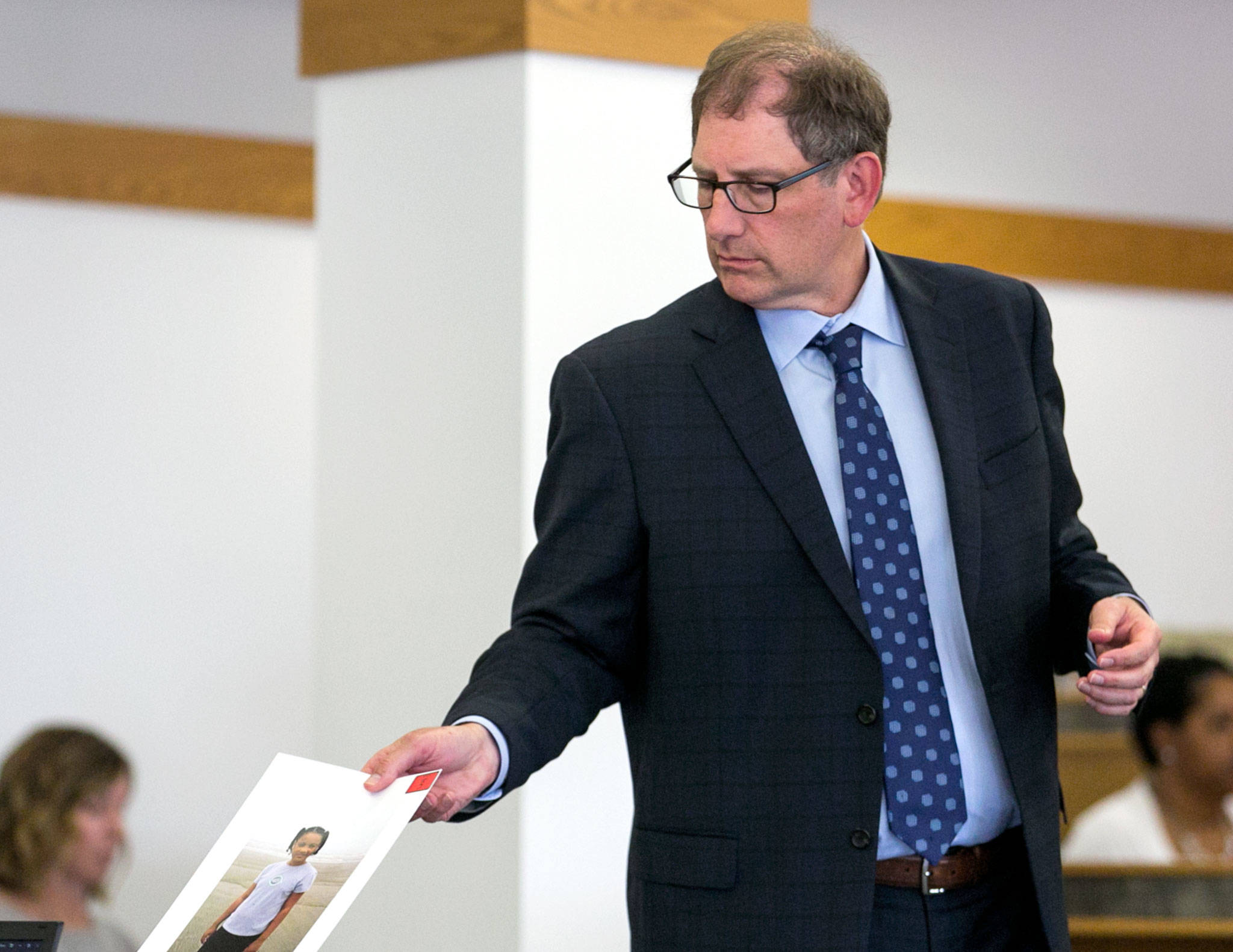 Snohomish County deputy prosecutor Tobin Darrow presents a photo for evidence in the trial of Todd Brown on Tuesday morning at the Snohomish County Courthouse in Everett. Brown is accused of vehicular homicide in the deaths of two children. (Kevin Clark / The Herald)