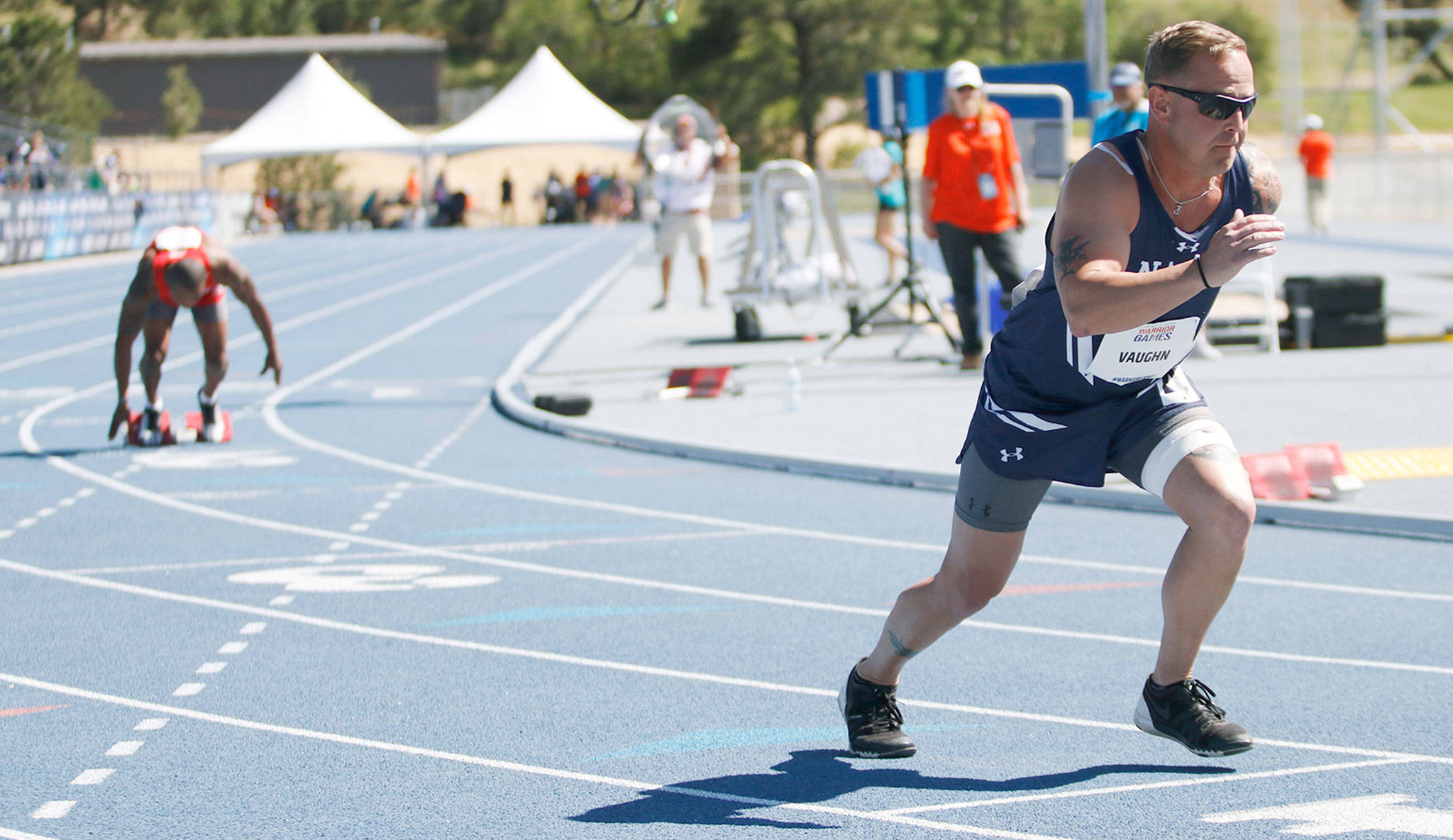 Chief Petty Officer Tim Vaughn, 36, member of Team Navy, of Marysville, competes in a race at the Warrior Games on June 2 at the Air Force Academy near Colorado Springs, Colorado. Vaughn was slashed and stabbed in the throat by a barber in Imperial Beach, California, in 2014. This week, he is competing in the Department of Defense Warrior Games for the first time. He is using the games as an opportunity to recover from the effects of PTSD. (Photo/Miranda Daniel, Grady Sports Bureau)