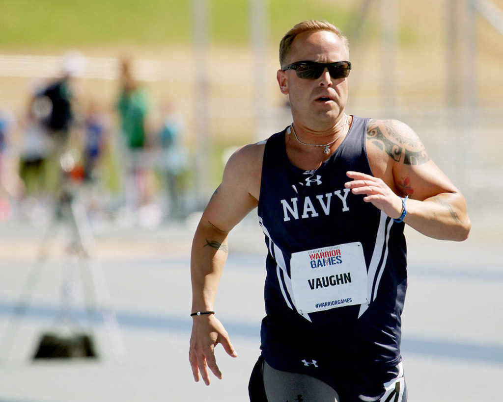 Chief Petty Officer Tim Vaughn, 36, member of Team Navy, of Marysville,	competes in a race at the Warrior Games on	June 2 at the Air Force Academy near Colorado Springs, Colorado. Vaughn was slashed and stabbed in the throat by a barber in Imperial Beach, California, in 2014. This week, he is competing in the Department of Defense Warrior Games for the first time. He is using the games as an opportunity to recover from the effects of PTSD. (Photo/Miranda Daniel, Grady Sports Bureau)
