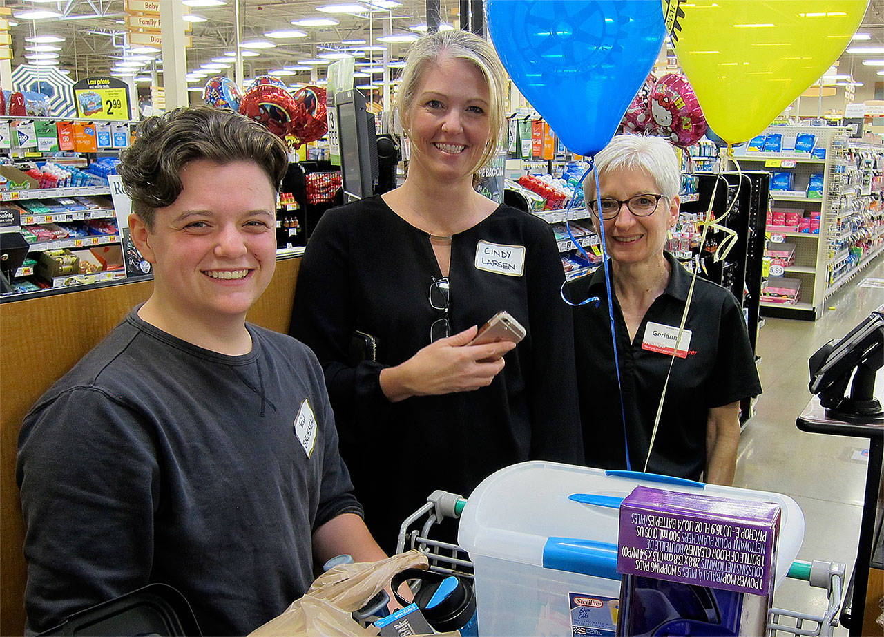 Funded with a $500 Rotary scholarship, Sequoia High School graduate Eli Brusseau purchased College Essentials items at the Mill Creek Fred Meyer store on June 7. With him were Rotarian Cindy Larsen (center) and Fred Meyer sales associate Gerianne Johnson. (Contributed photo)