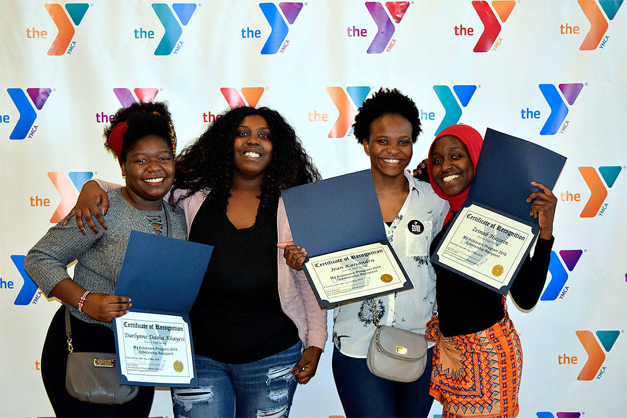 MAP Scholarship winners from Everett High School (from left) Darlynne Dasha Khayesi, MAP leader Karshay James, Jean Kassandra, and Zeinab Hussein. Not pictured is Mariam Konate. (Contributed photo)