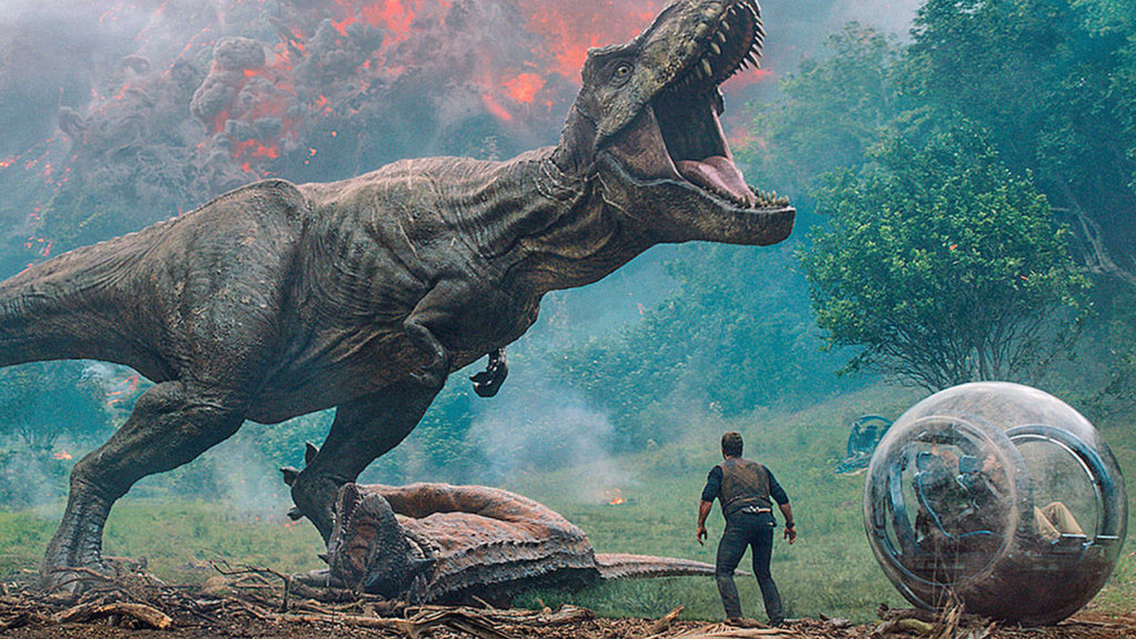 The dinos must contend with a volcanic eruption and meddling humans in “Jurassic World: Fallen Kingdom.” (Universal Pictures and Amblin Entertainment)
