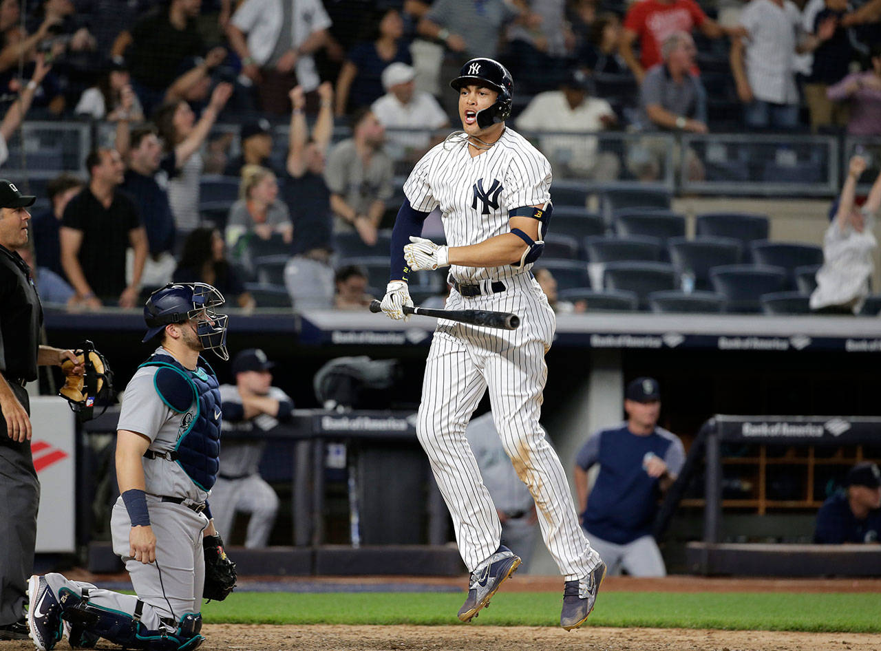 The Yankees’ Giancarlo Stanton reacts after hitting a walk-off home run in the ninth inning against the Mariners on June 20, 2018, at Yankee Stadium in New York. (AP Photo/Seth Wenig)
