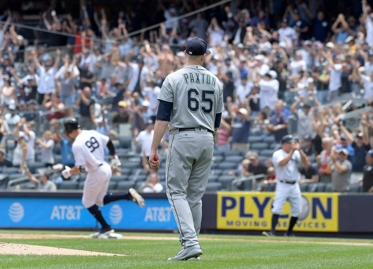 Seattle’s James Paxton looks on as New York’s Aaron Judge rounds the bases after hitting a two-run home run in the first inning of Thursday’s game at Yankee Stadium. (AP Photo/Bill Kostroun)