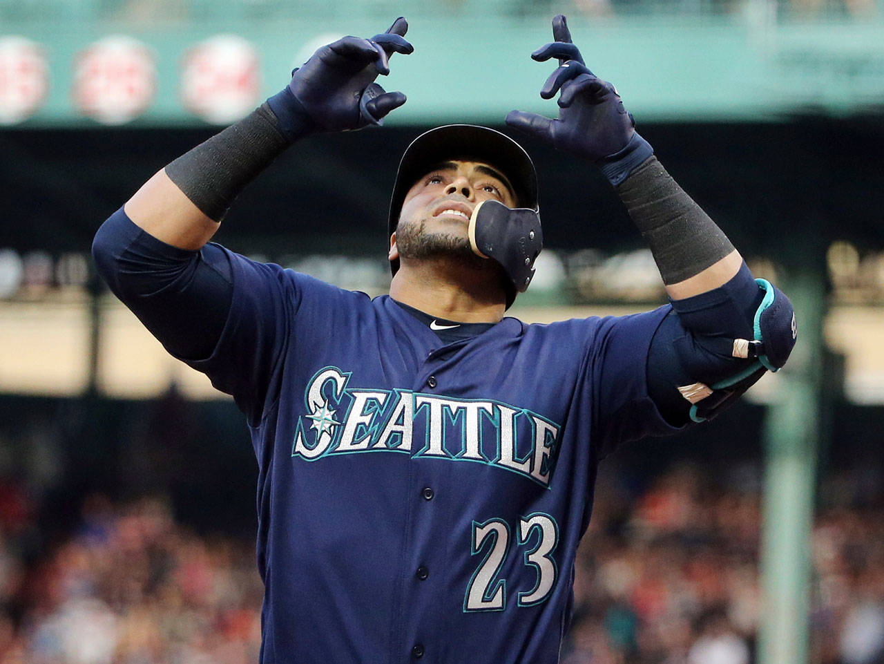 Seattle’s Nelson Cruz celebrates his three-run home run during the first inning of Friday’s game in Boston. (Elise Amendola / Associated Press)