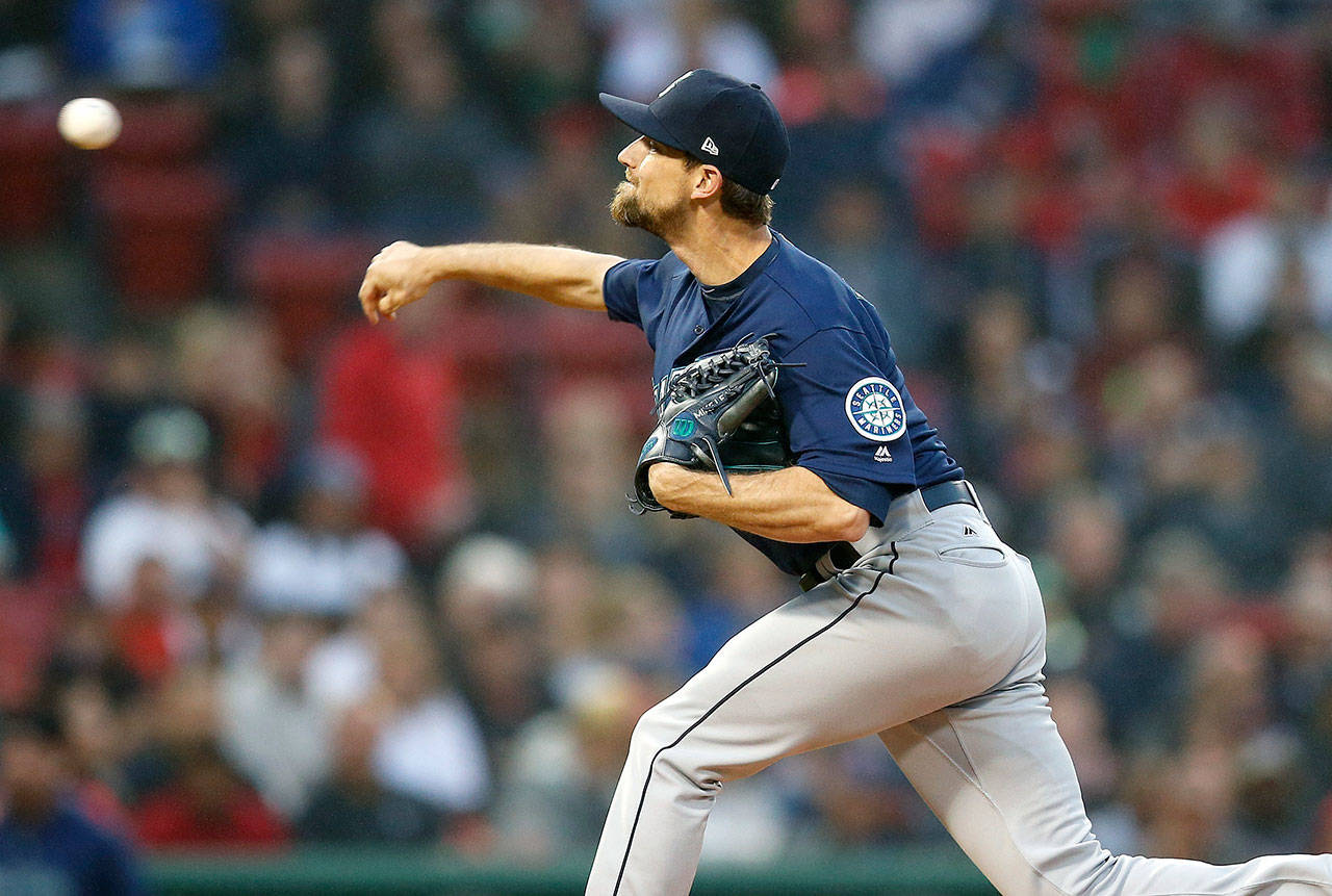 Seattle’s Mike Leake throws a pitch during the first inning of Saturday’s game in Boston. (AP Photo/Michael Dwyer)