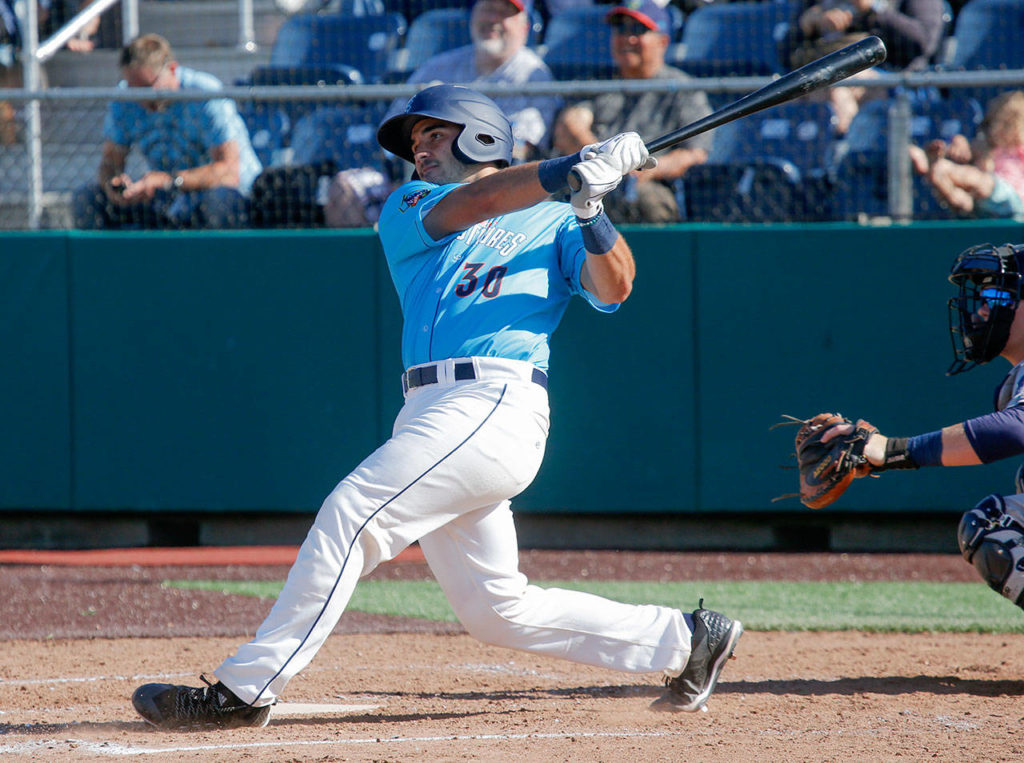 The Aquasox’ Jake Anchia hits a run-scoring double for Everett during Sunday’s game against Tri-City. (Andy Bronson / The Herald)
