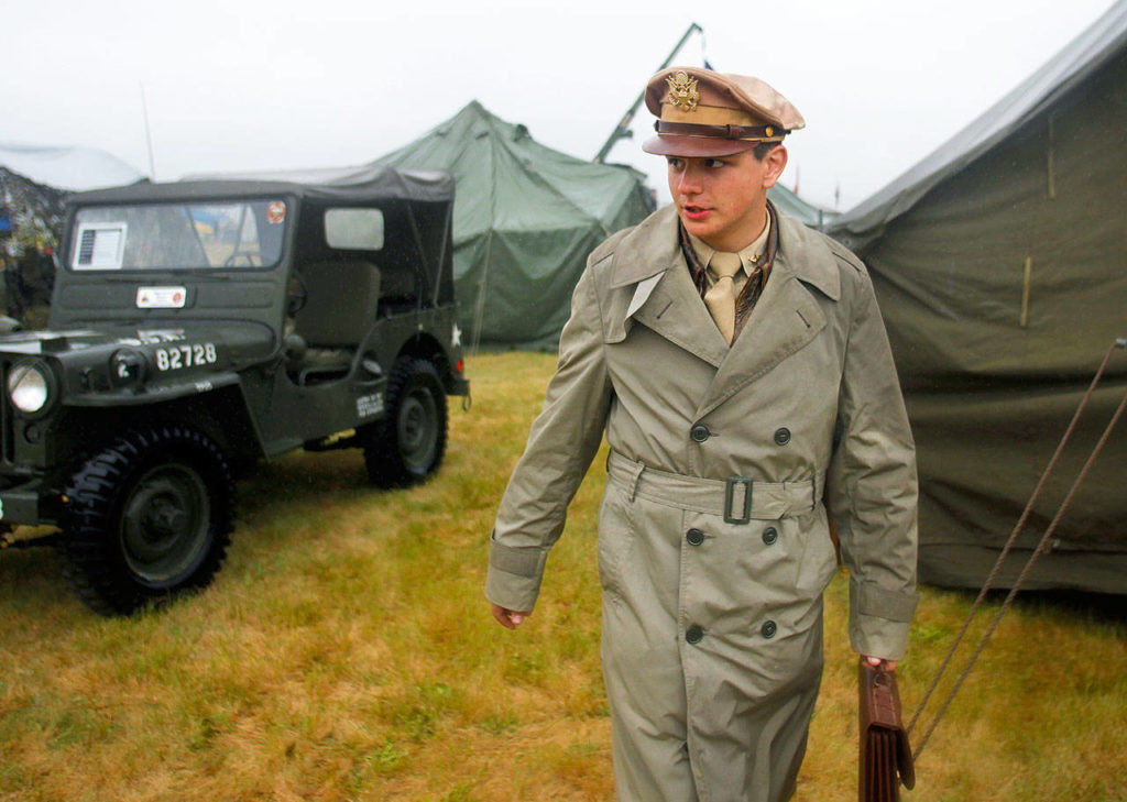 Aaron LaPointe, 14, walks across Camp Adams at the Arlington Fly-In in 2012. LaPointe was dressed as an Army Air Corps pilot. (Herald file)
