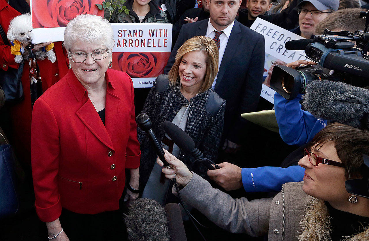Barronelle Stutzman (left), a Richland florist, smiles as she is surrounded by supporters after a hearing in Bellevue on Nov. 15, 2016. The Supreme Court on Monday ordered Washington courts to take a new look at Stutzman’s case because of her religious objection to same-sex marriage. (AP Photo/Elaine Thompson, File)