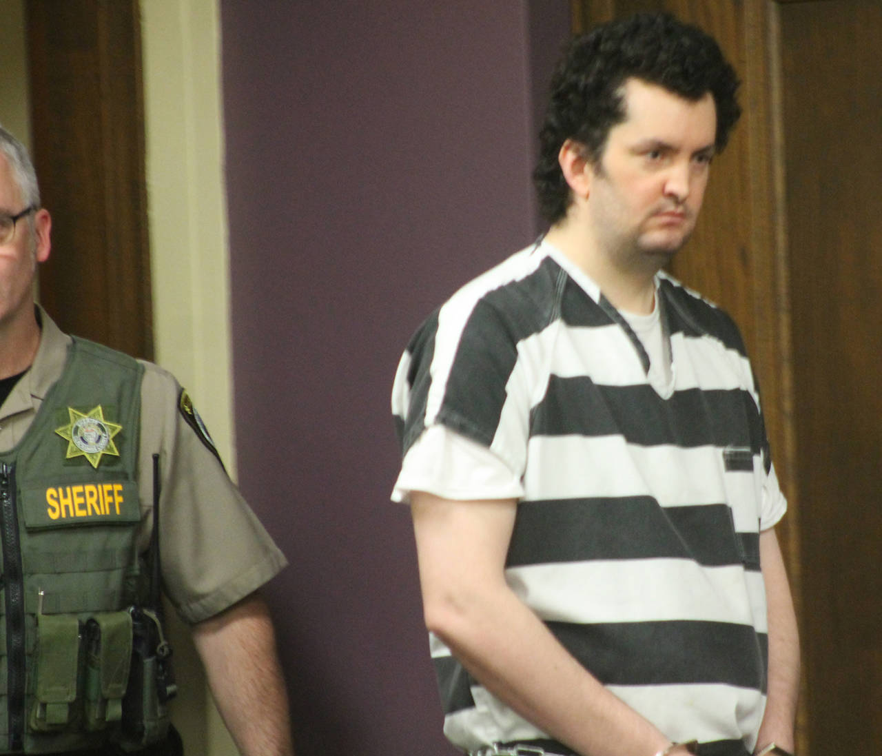 Joshua Webb appears in Clackamas County Circuit Court in Oregon City, Oregon, on June 26, where he pleaded guilty except for insanity in the May 2017 killing of his mother and his dog at his home in Colton, and stabbing of a grocery store employee in a neighboring town. He was sentenced to life in state psychiatric custody. (Everton Bailey Jr./The Oregonian via AP)