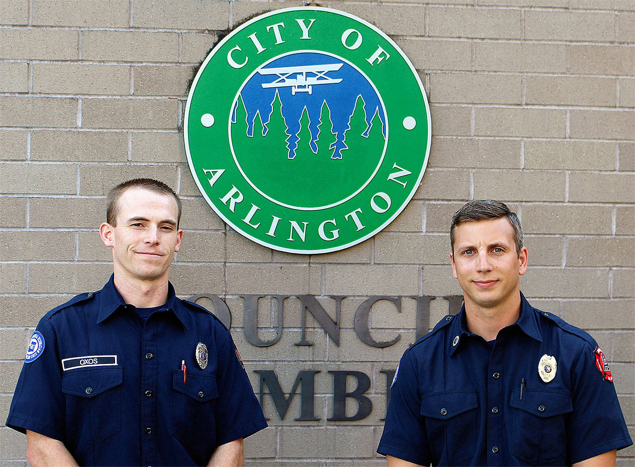 Arlington firefighters Joe Oxo (left), Rein Frankie and Aaron Boede (not pictured) were honored with Phoenix awards for life-saving efforts. (Contributed photo)