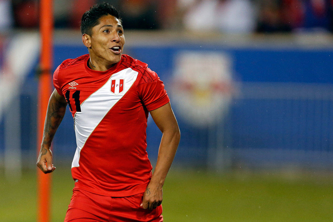 Peru forward Raul Ruidiaz (11) celebrates scoring a goal against Iceland during the second half of an international friendly on March 27, 2018, in Harrison, N.J. The Seattle Sounders signed Ruidiaz to a designated player contract Friday. (AP Photo/Adam Hunger)