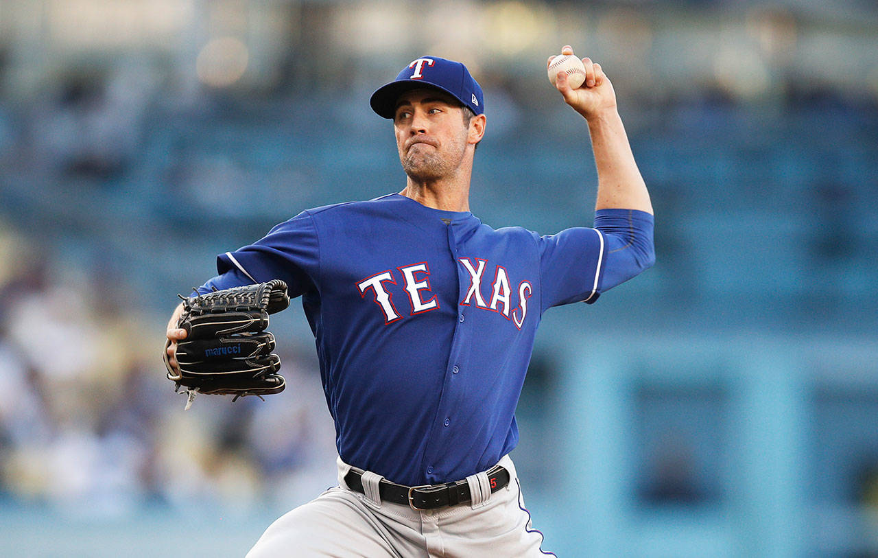 Texas Rangers starting pitcher Cole Hamels throws against the Los Angeles Dodgers during an MLB game on June 13 in Los Angeles. (Jae C. Hong / Associated Press)