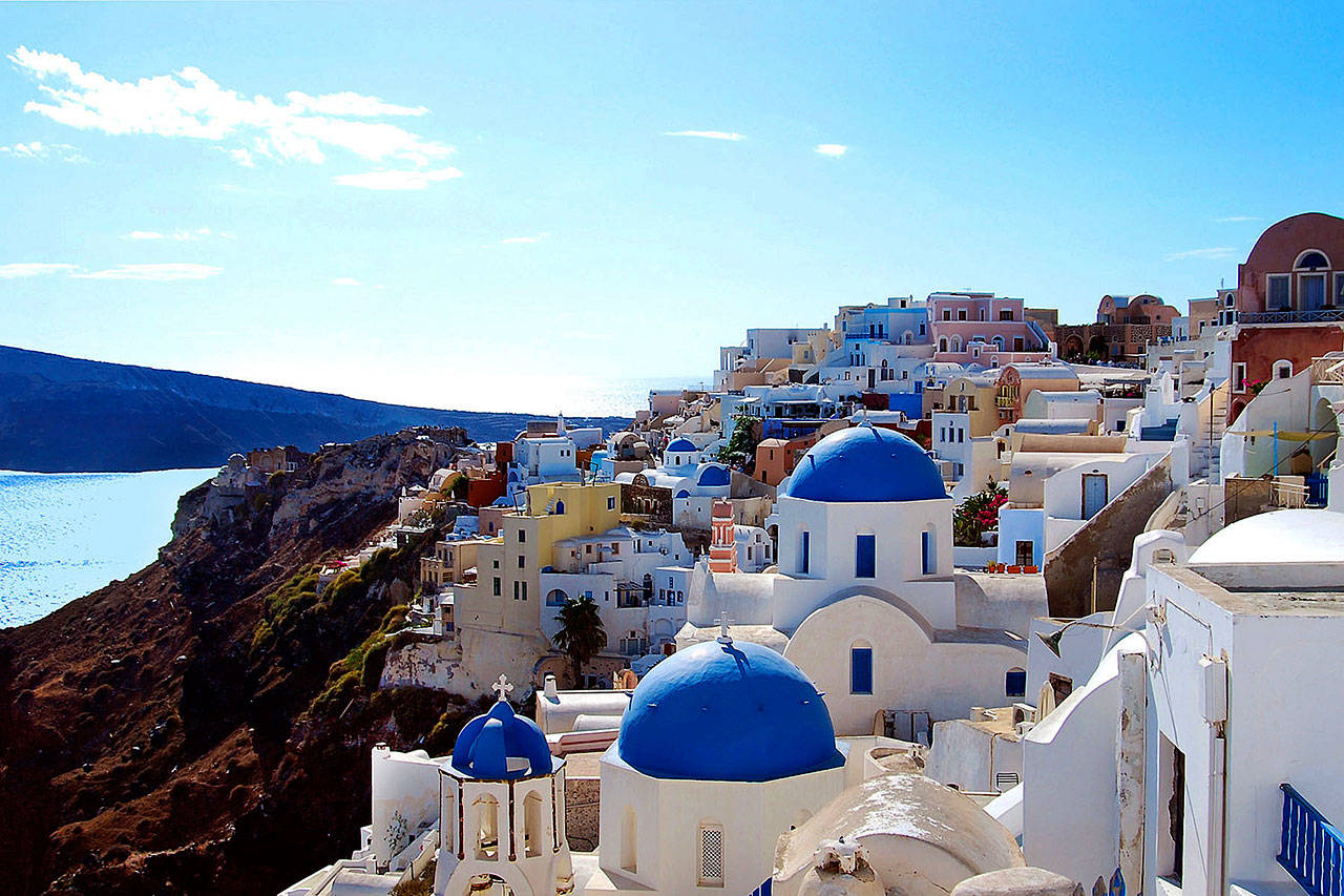 The picture-perfect village of Oia in Santorini, resting a thousand feet high on a volcanic crater, is a dream come true for photographers and sunset watchers. (Trish Feaster / Rick Steves’ Europe)