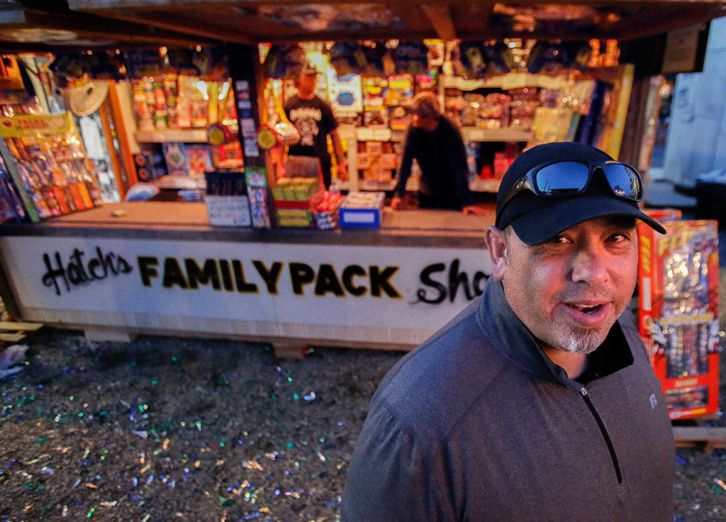 Tony Hatch, 48, has sold fireworks from this spot in Boom City since 2000. One of his favorite fireworks is the 12th Man, which he likes to set off when the Seahawks score a touchdown. (Dan Bates / The Herald)

