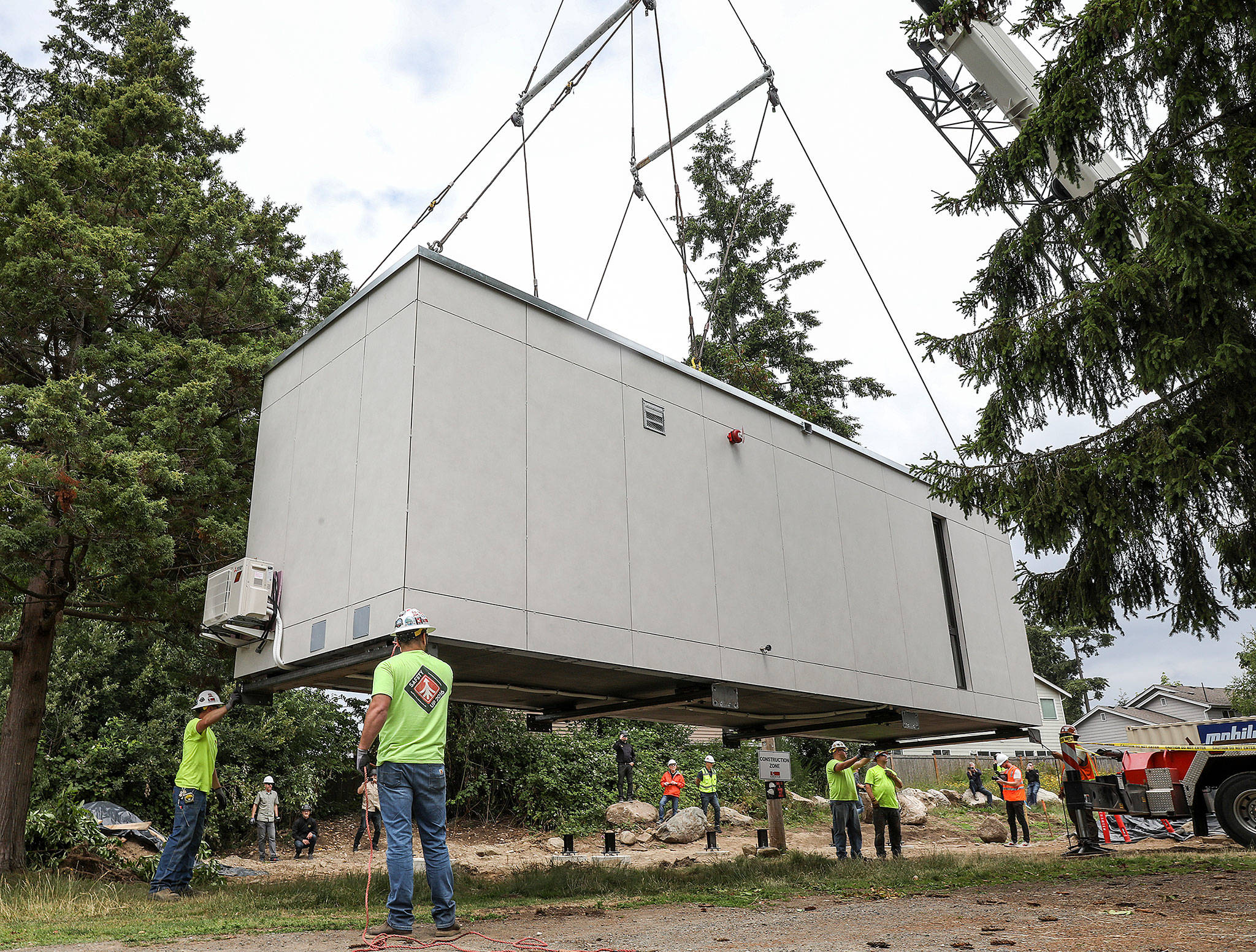 The first Blok unit by the start-up Blokable is placed on the grounds of the Edmonds Lutheran Church on June 29. The church is partnering with Compass Housing Alliance to build low-income housing on its property. (Lizz Giordano / The Herald)