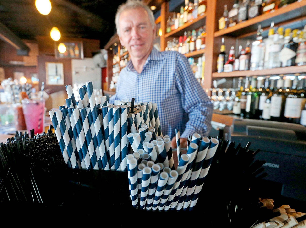Paper straws at a bar owned by Duke Moscrip, owner of Duke’s Restaurants, in Seattle. (Greg Gilbert/The Seattle Times via AP)