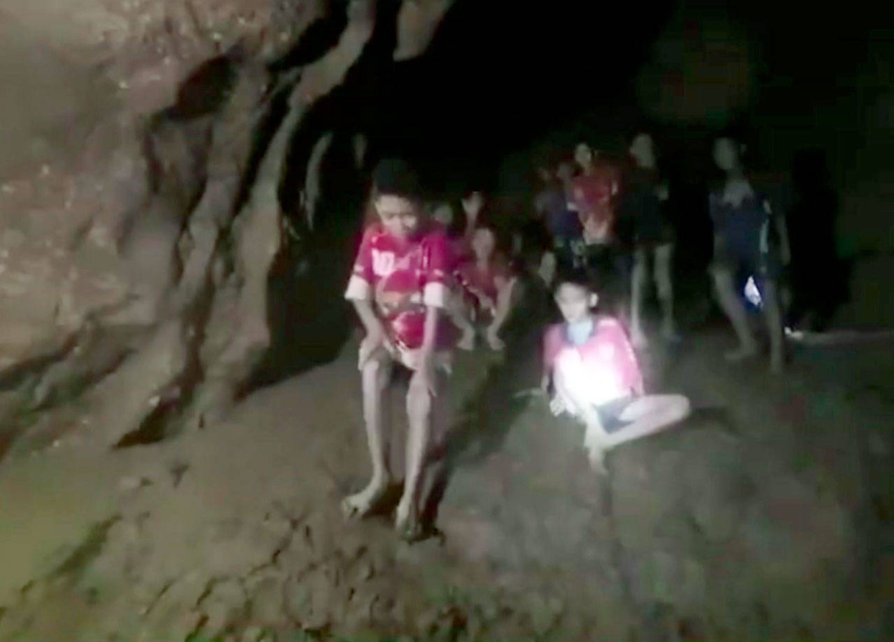This image from video shows boys and their soccer coach as they are rescued in a cave in Thailand on Monday. (Thai Navy Seals via AP)