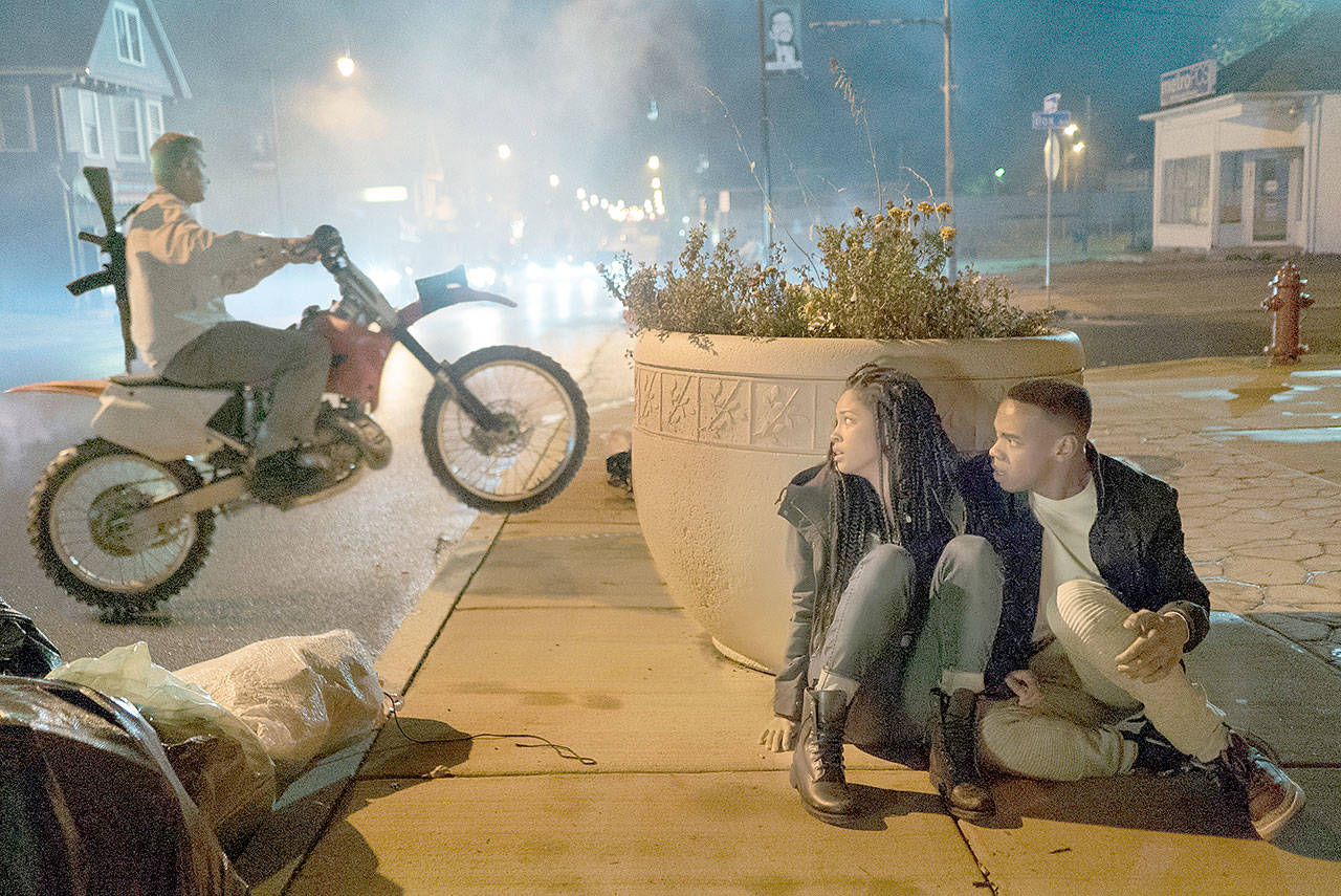 Lex Scott Davis and Joivan Wade hide from rampaging mobs in “The First Purge.” (Universal Pictures)
