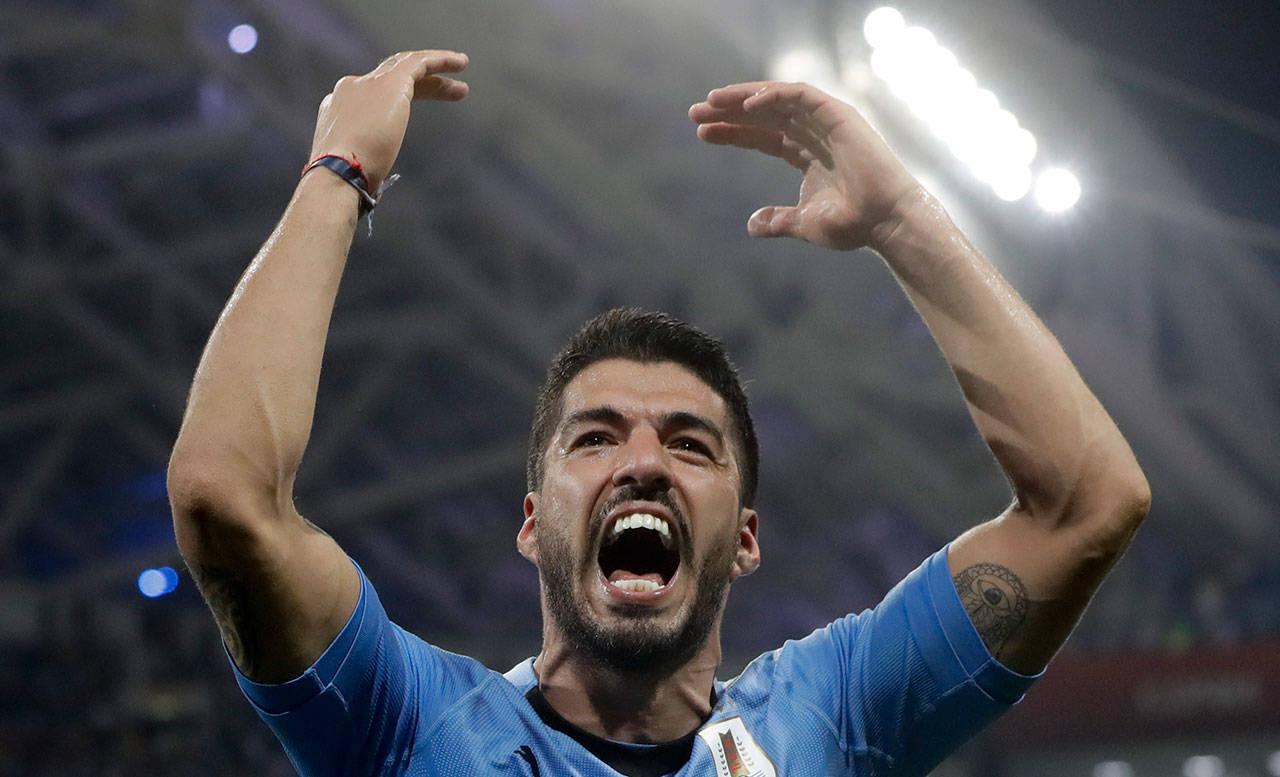 Uruguay’s Luis Suarez celebrates after a round of 16 match against Portugal at the World Cup on June 30, 2018, at Fisht Stadium in Sochi, Russia. (AP Photo/Andre Penner)
