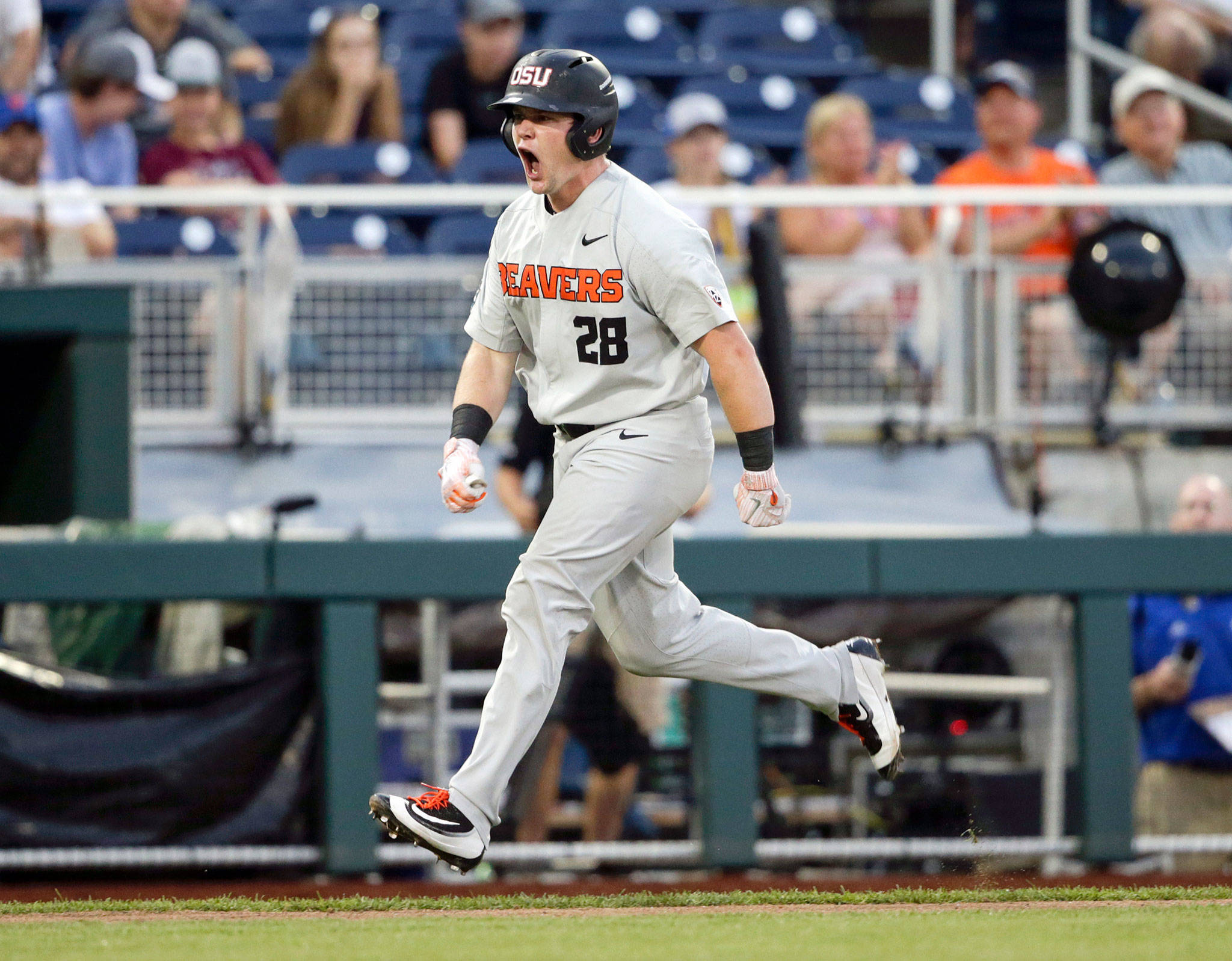 Oregon State designated hitter Kyle Nobach, a graduate of Marysville Pilchuck High School, celebrates after hitting a three-run home run against Washington in the seventh inning of an College World Series elimination game on June 18, 2018, in Omaha, Neb. (AP Photo/Nati Harnik)