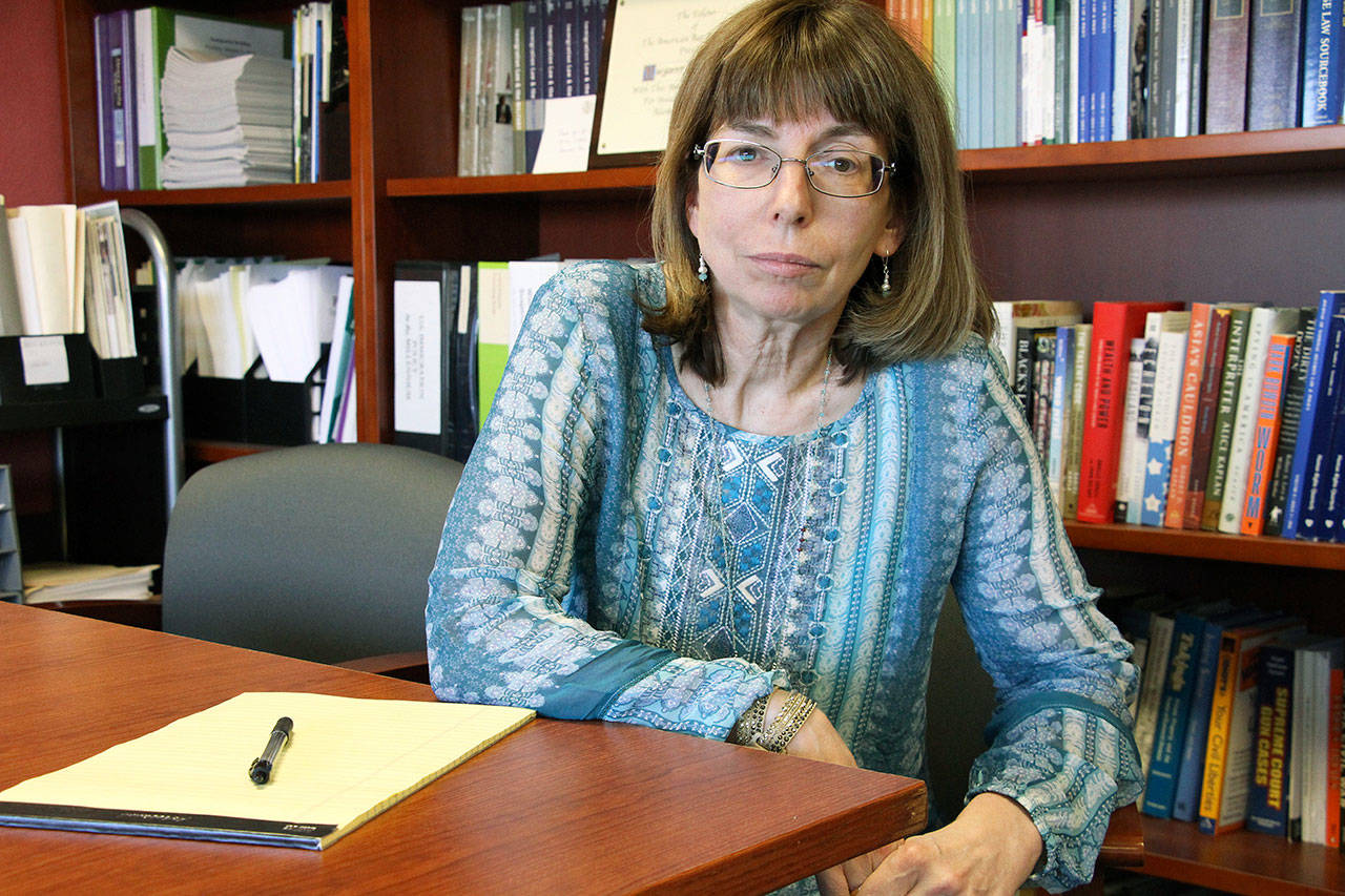 Margaret Stock, an Alaska-based immigration attorney and a retired Army Reserve lieutenant colonel who helped create the immigrant recruitment program, poses at her office in Anchorage, Alaska, on Tuesday. The U.S. Army has moved in recent weeks to discharge some immigrant recruits and reservists who enlisted through a program that promised them a path to citizenship. Stock said she’s been inundated over the past several days by recruits who report being abruptly discharged. (AP Photo/Mark Thiessen)