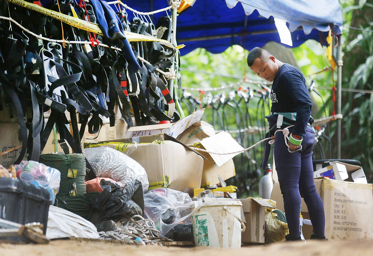 Thai rescuers prepare to enter the cave where 12 boys and their soccer coach have been trapped since June 23, in Mae Sai, Chiang Rai province, in northern Thailand on Friday. (AP Photo/Sakchai Lalit)