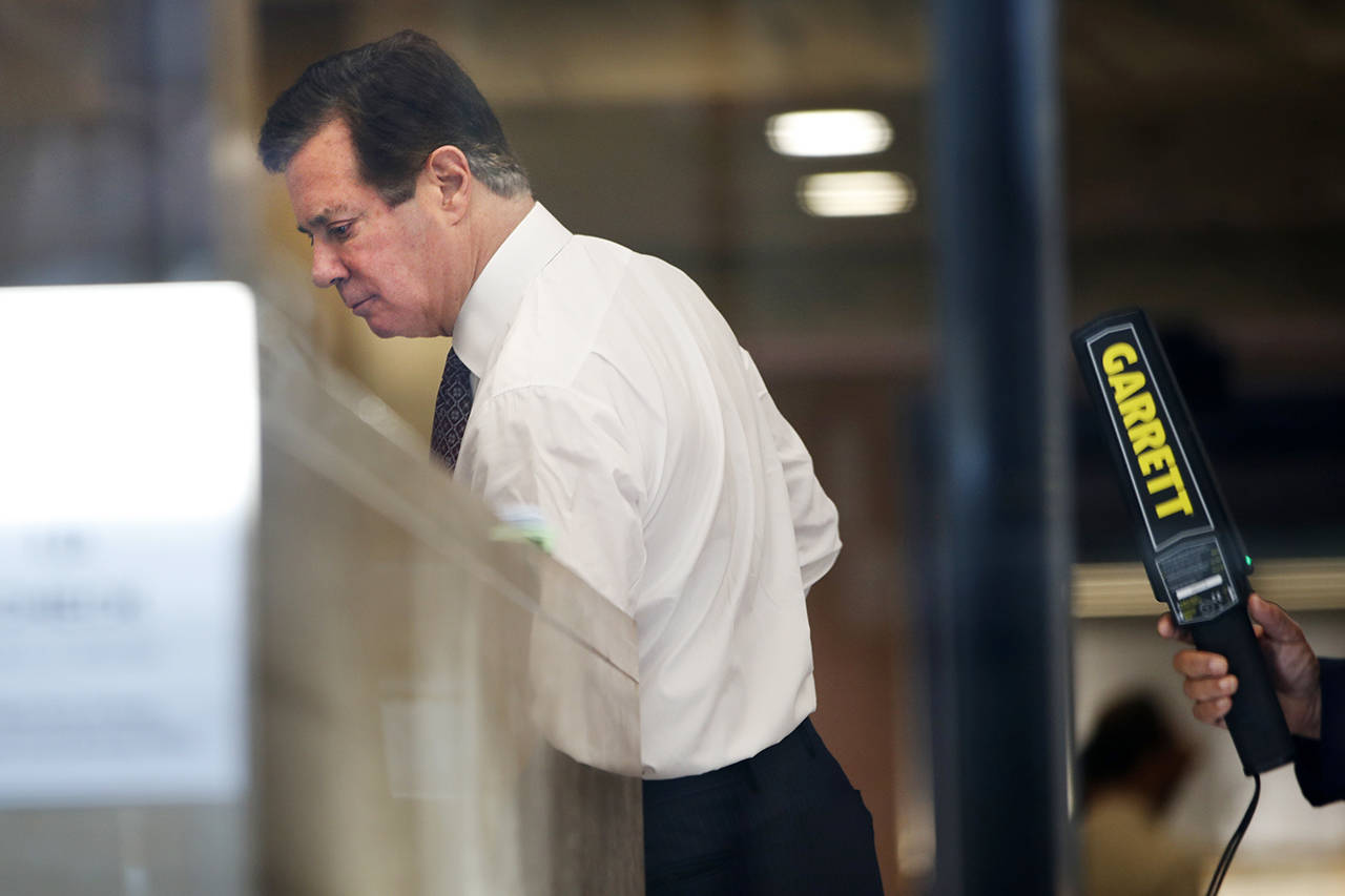Paul Manafort goes through security as he arrives at federal court on June 15 in Washington. (AP Photo/Jacquelyn Martin, file)