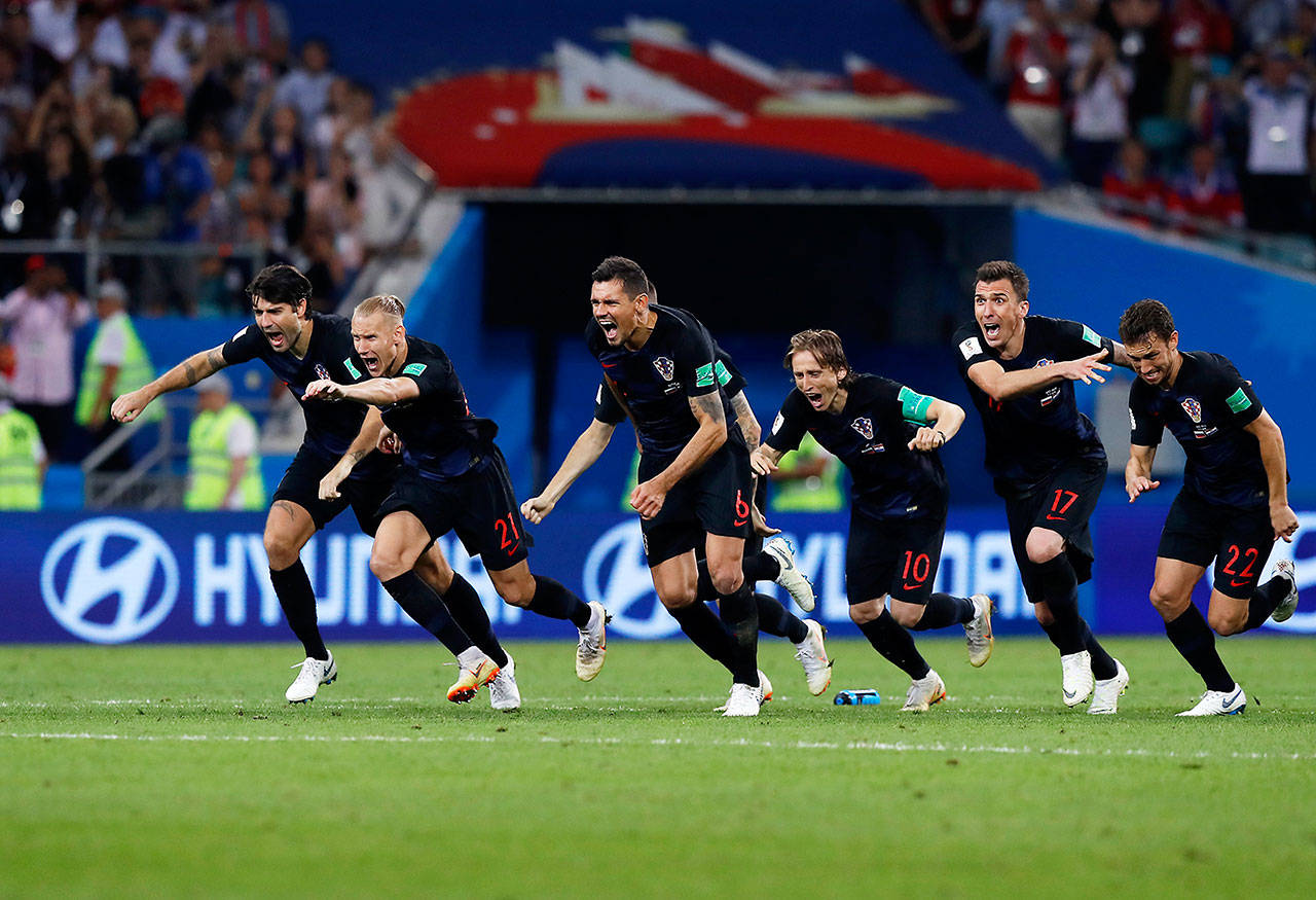 Croatian players celebrate after winning a quarterfinal match Saturday against Russia at the 2018 World Cup at the Fisht Stadium in Sochi, Russia. (Manu Fernandez / Associated Press)