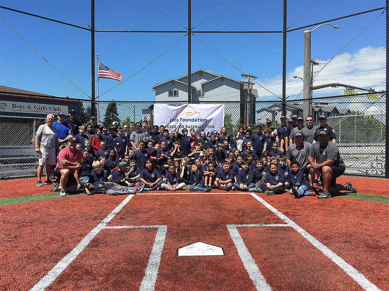 The Cal Ripken Sr. Foundation and LIDS Foundation teamed up with country music recording artist and Ripken Foundation advocate Matt Stillwell, in partnership with Everett Police Department and the Seattle Mariners, to host a LIDS Badges for Baseball clinic on July 2 with more than 125 youth from the Boys & Girls Club of Snohomish County. (Contributed photo)