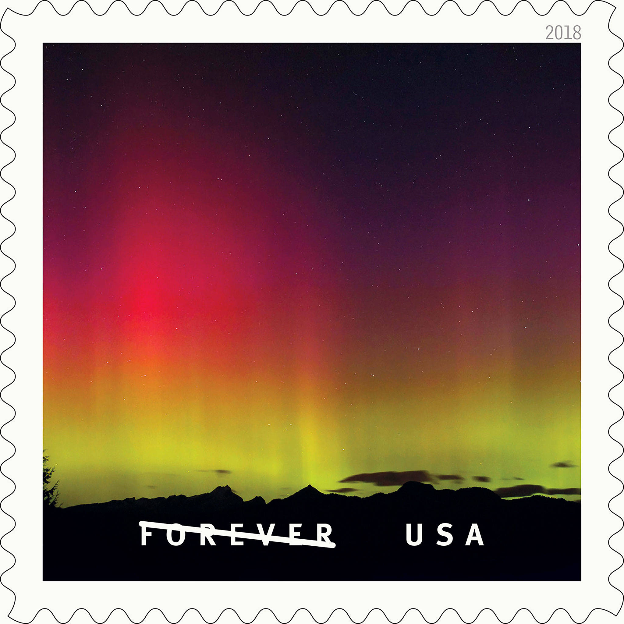 Lynnwood’s Kevin Ebi, a nature photographer, took this image of the northern lights over Three Fingers Mountain in Snohomish County during a solar storm in 2003. It is featured as one of 20 stamps in the U.S. Postal Service’s “O Beautiful” series released last week.