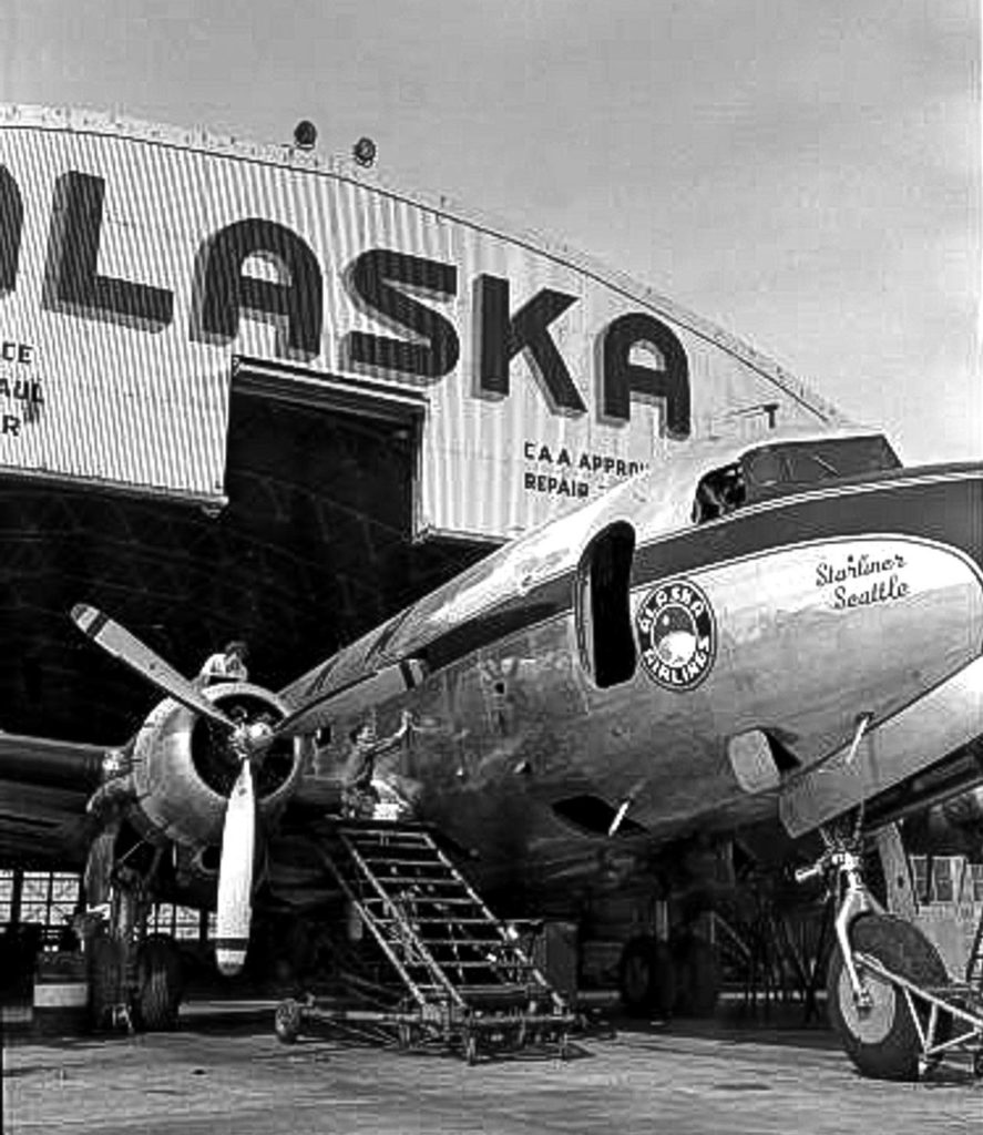 A DC-4 dubbed the Starliner Seattle in the Alaska Airlines repair and maintenance hangar at Paine Field in 1951. Alaska will soon offer commercial flights from the Everett airport. (Ken Knudson / Everett Herald)
